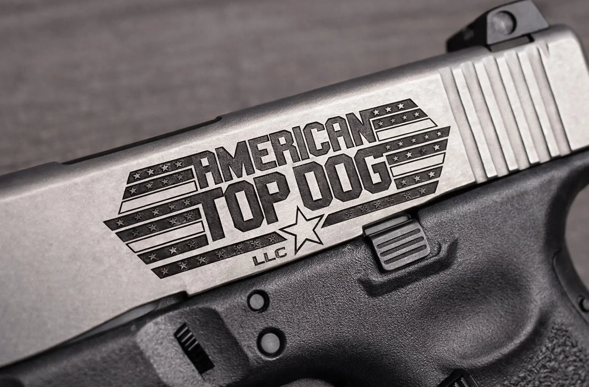 Gun slide with "American Top Dog" engraving.